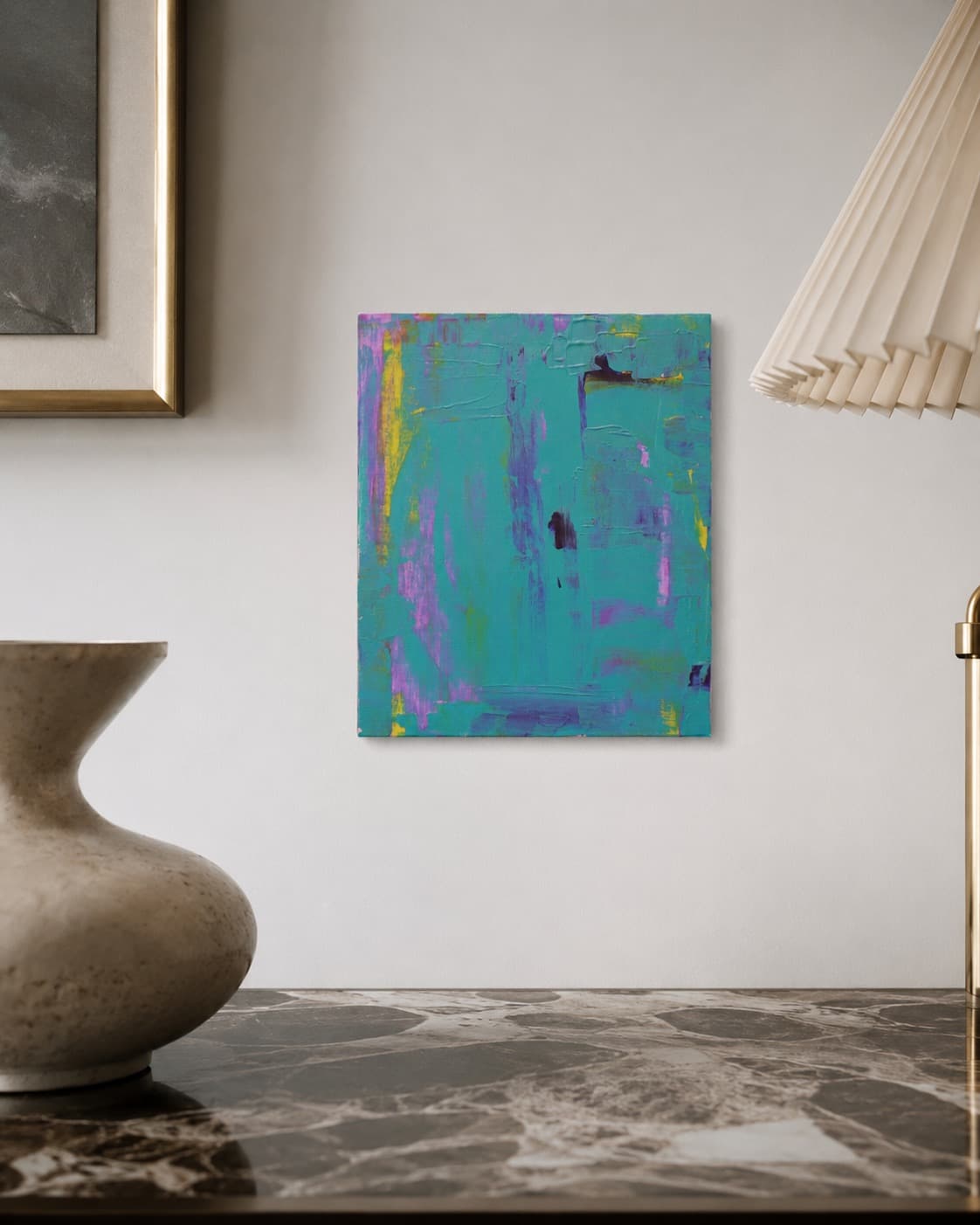 Electric Iris, a small teal, purple, and yellow abstract painting by Julia Mindar, shown installed near a framed piece and lamp