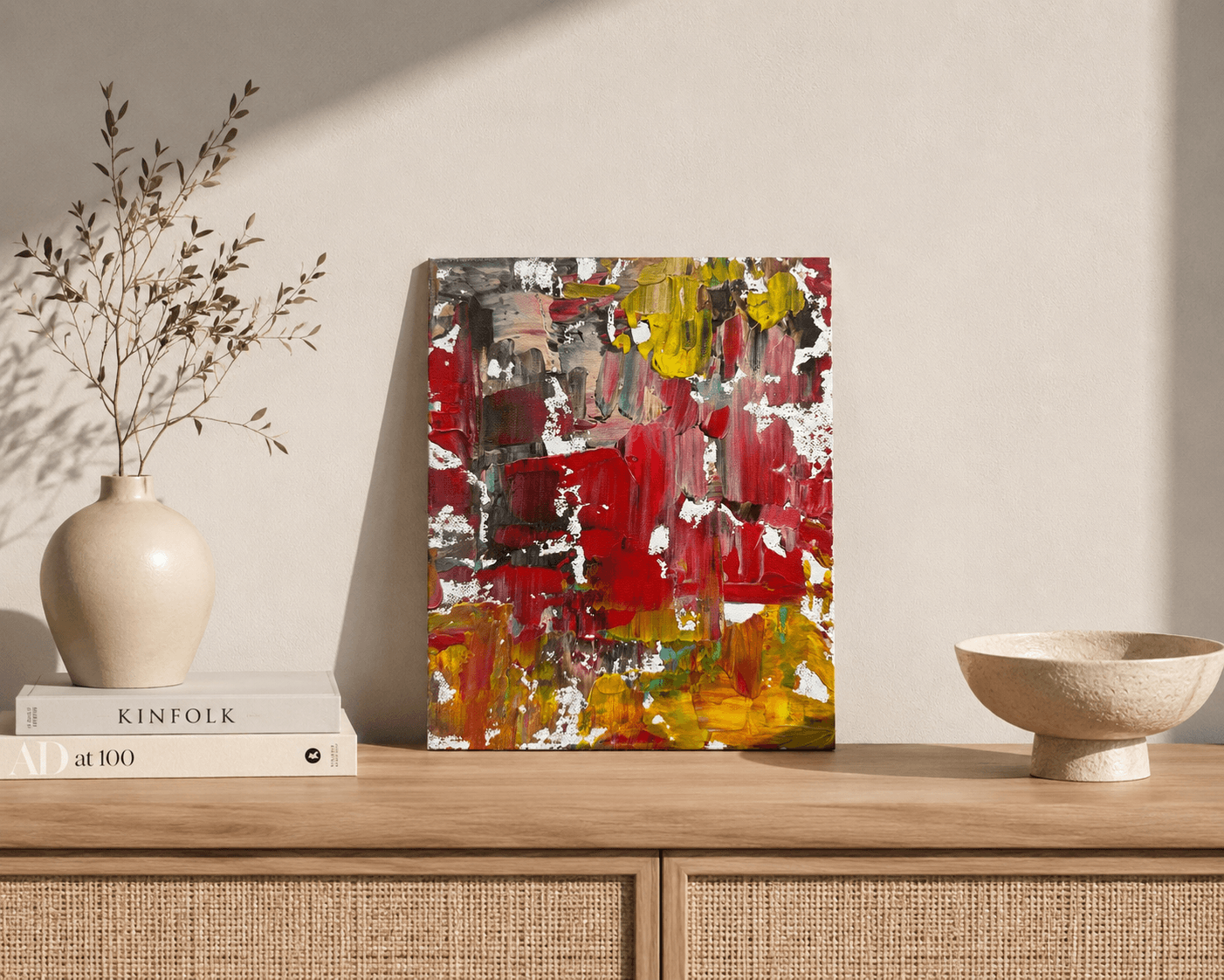 Wildfire, a small red, gold, and yellow abstract painting by Julia Mindar, shown on a wood shelf