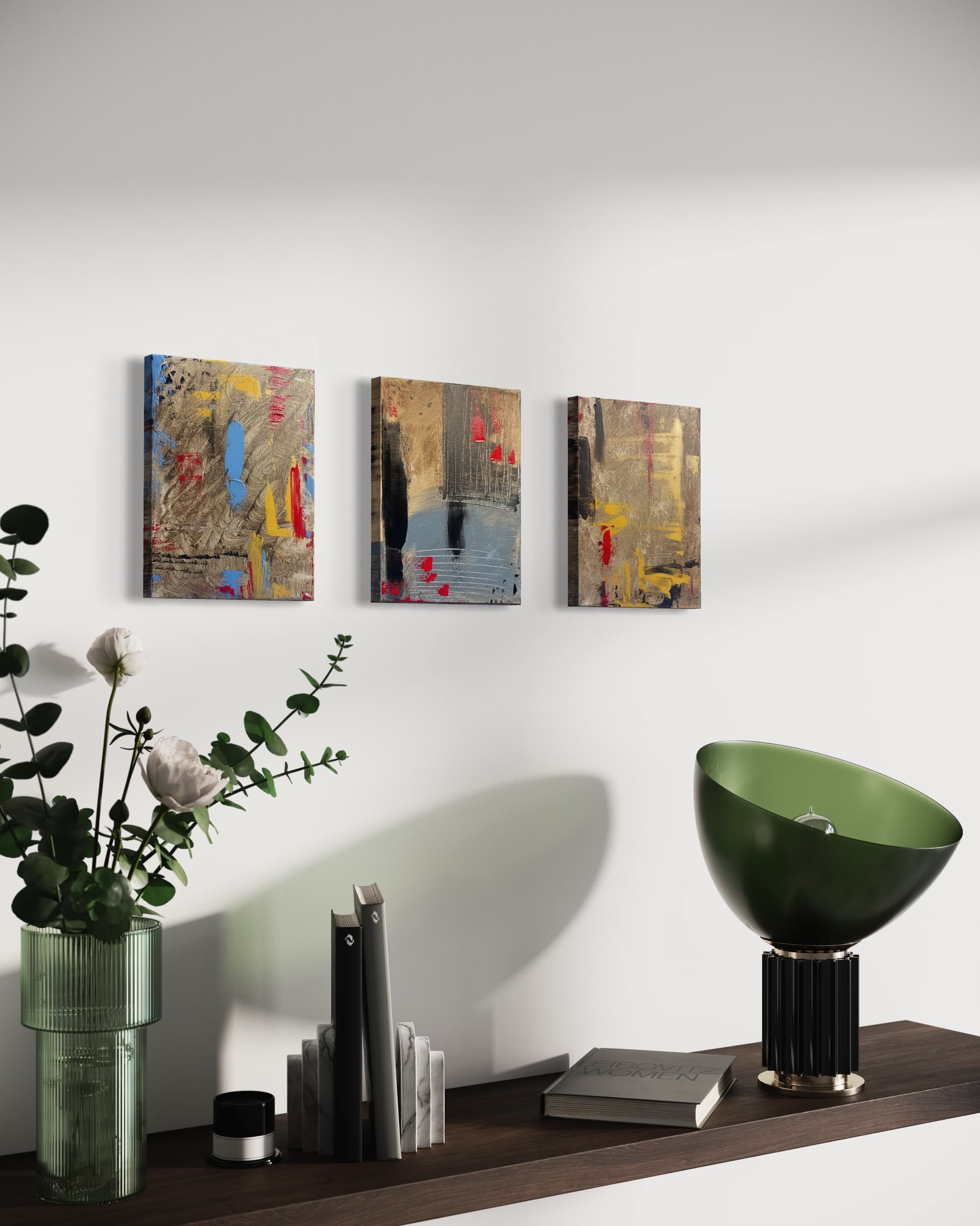 Chronicle, a three-panel gold, black, red, and blue abstract triptych by Julia Mindar, shown installed on a wall