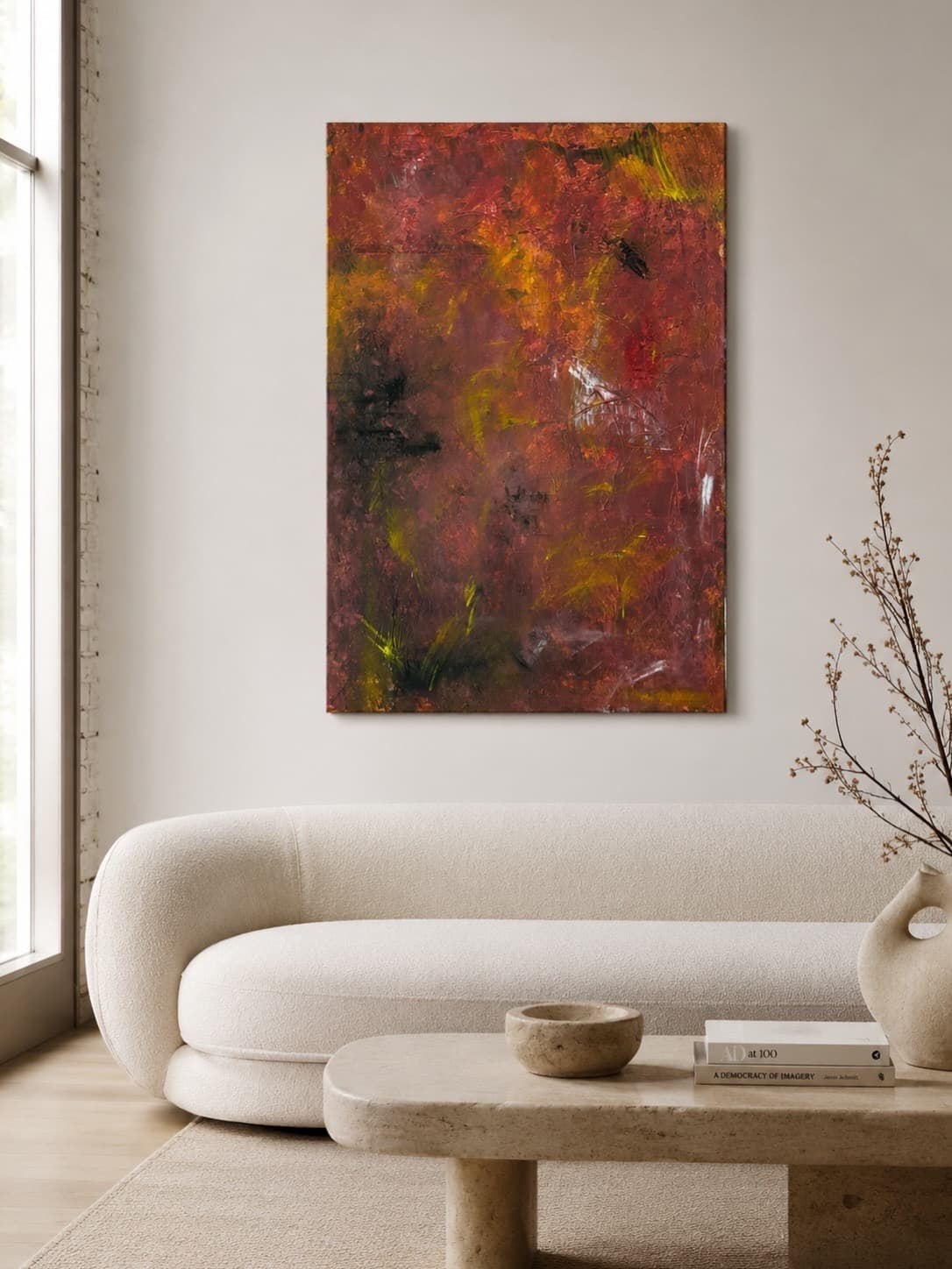 Ember Field, a rust red, copper, and chartreuse abstract painting by Julia Mindar, shown installed above a boucle sofa in a living room