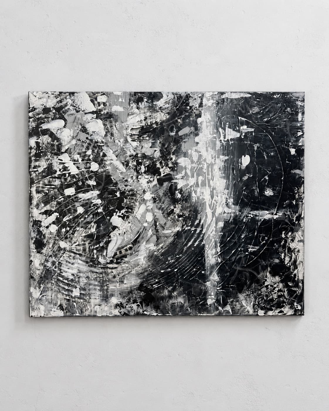 Riptide, a dense black and white gestural abstract painting by Julia Mindar with circular ripple brushwork, shown installed above a console