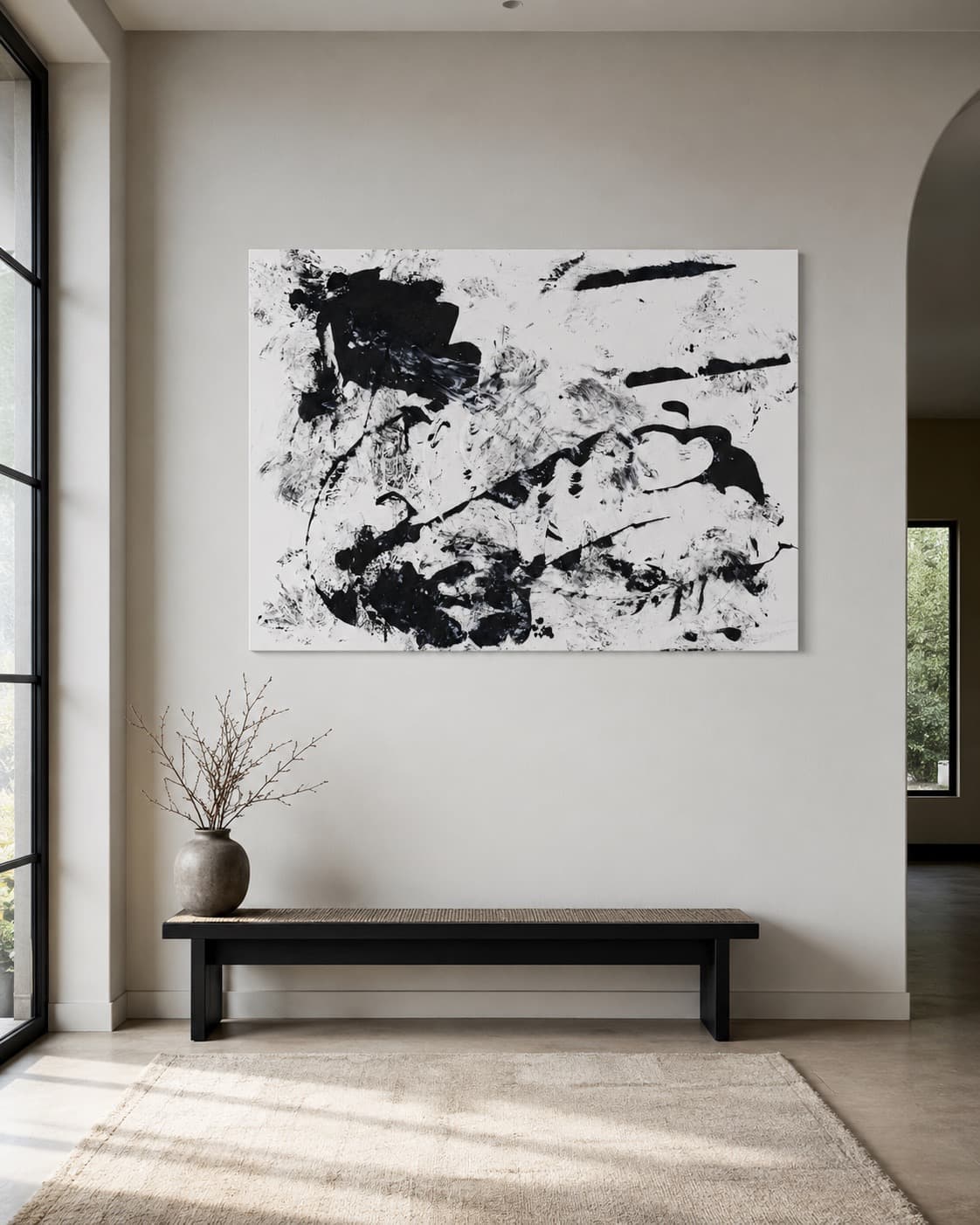Static, a black and white gestural abstract painting by Julia Mindar, shown installed in an entry hallway